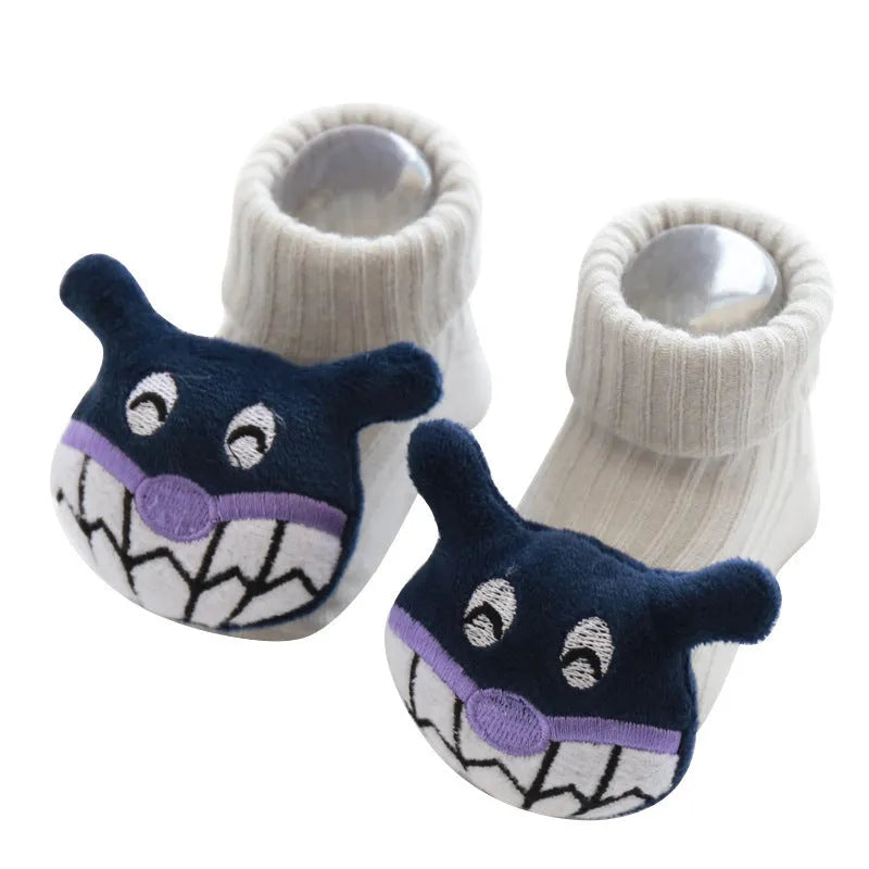 Cotton baby floor socks in assorted colours and patterns including bows, stars, and animal designs.