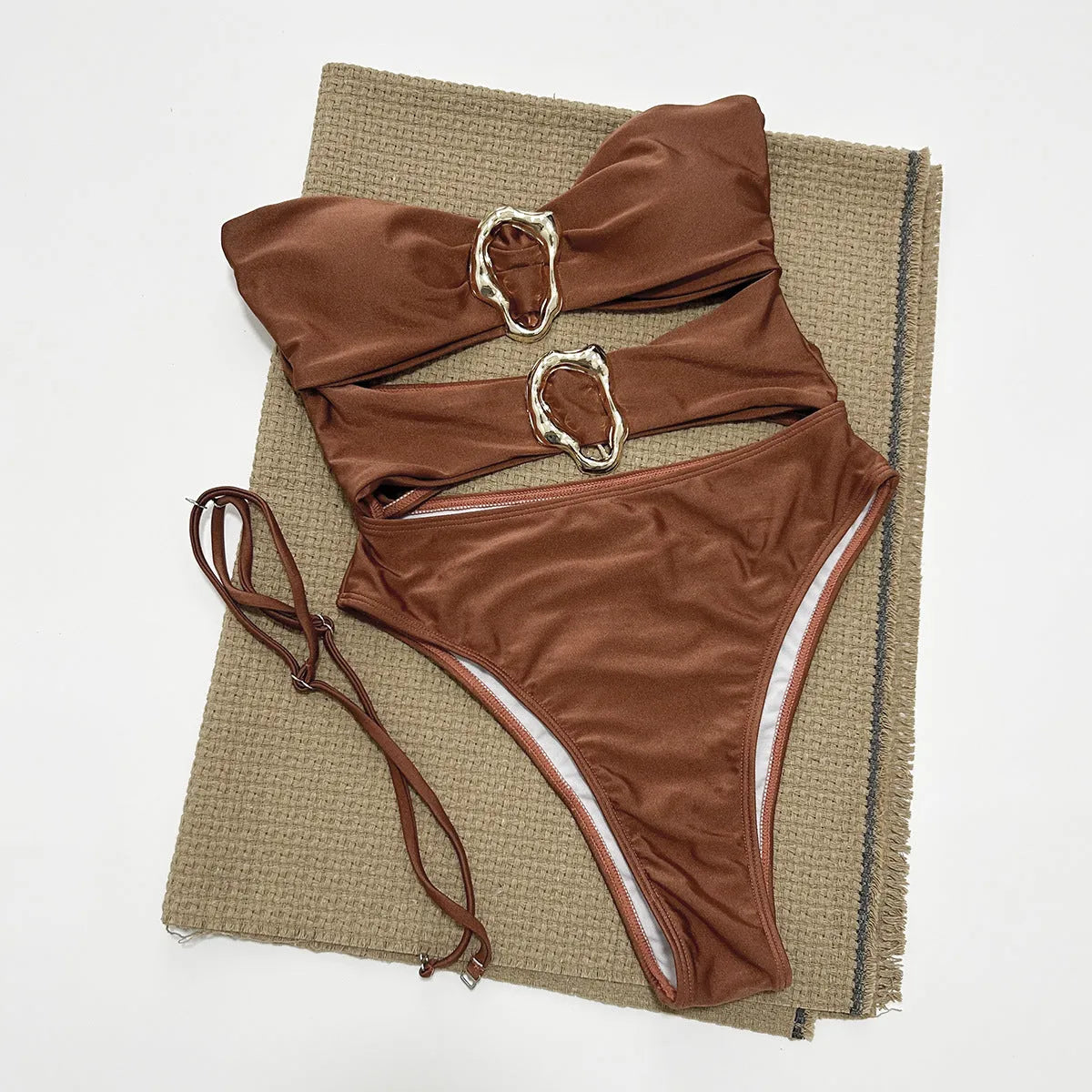 Women's solid colour one-piece swimsuit in black, brown, or red with nylon spandex lining, sizes S M L