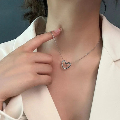Stylish titanium steel heart pendant necklace with unique twist design, available in gold and silver colors
