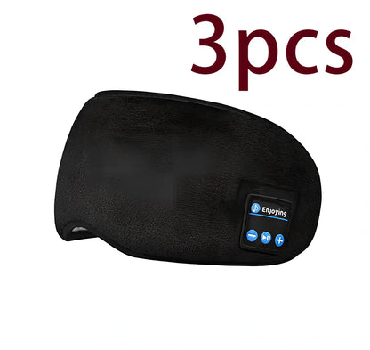 Black Bluetooth 5.0 eye mask with adjustable elastic strap and built-in speakers for wireless audio