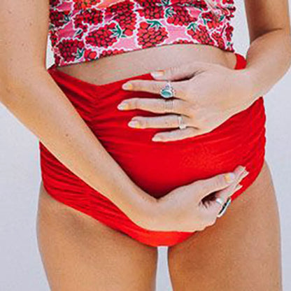 High waist maternity swimwear in red, designed for comfort and support during pregnancy