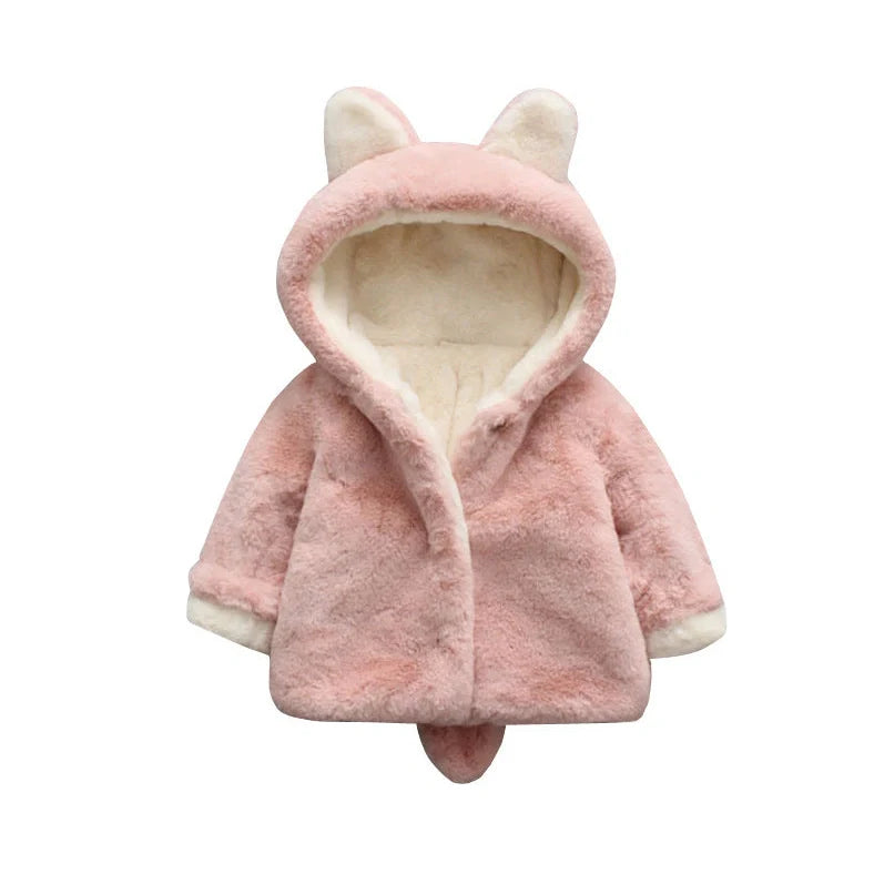 Baby wearing pink cotton coat with velvet accents, showing flocking fabric texture and cotton filling insulation