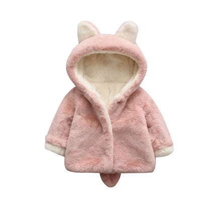 Baby wearing pink cotton coat with velvet accents, showing flocking fabric texture and cotton filling insulation