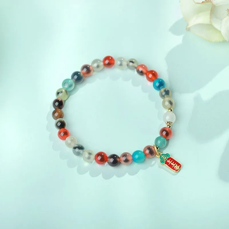 Women's natural agate bracelet with copper coin snake elements in geometric design