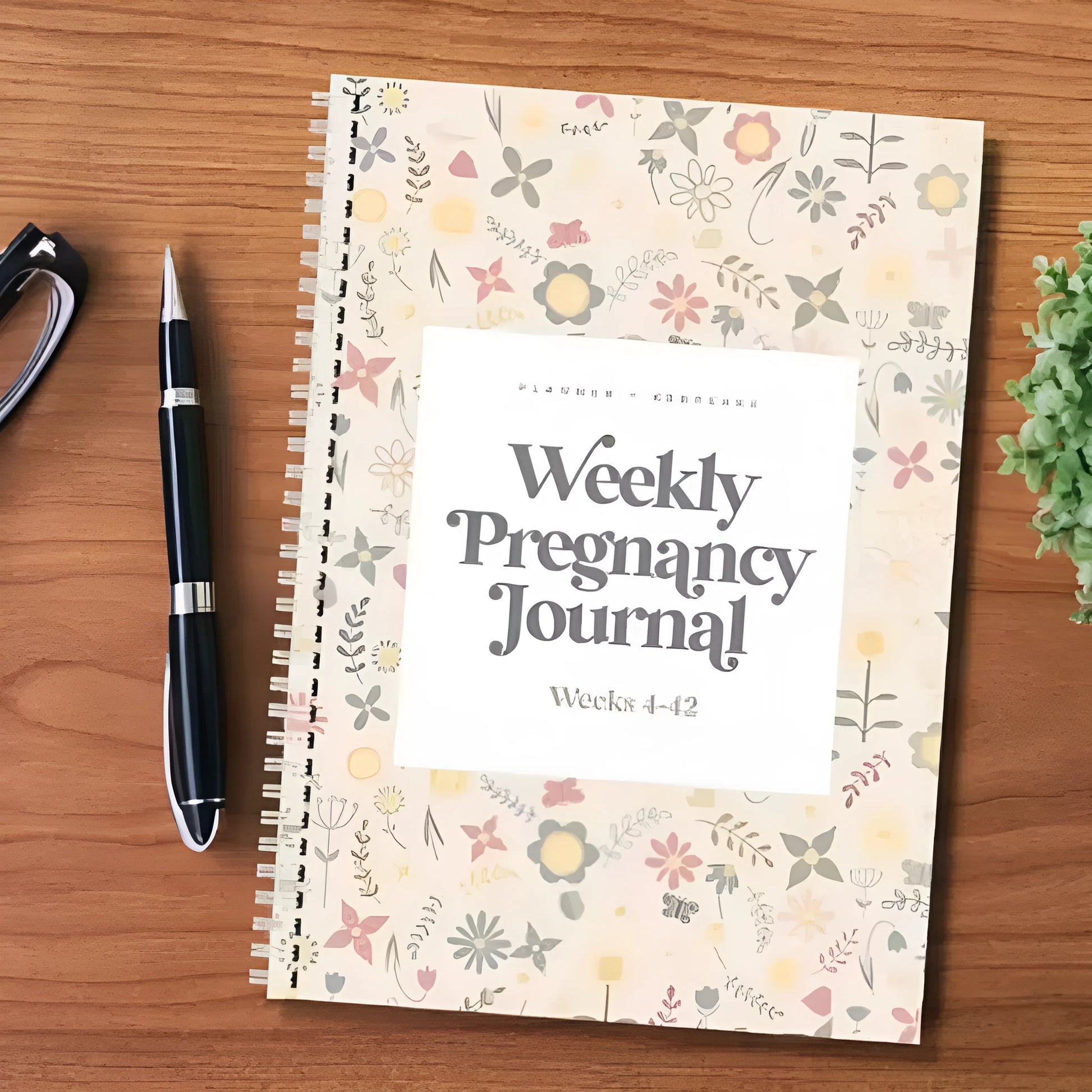A5 Pregnancy Weekly Diary Notebook open to show weekly layout pages