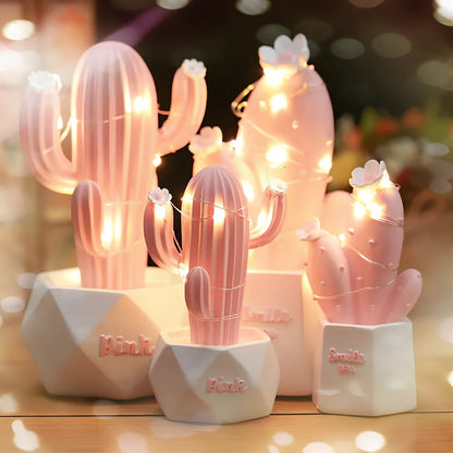 Cactus-shaped resin night light in gold finish measuring 15cm tall with warm LED glow