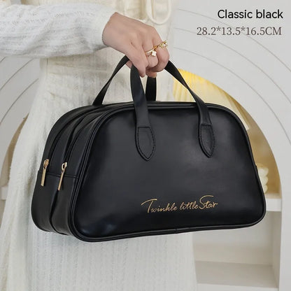 Leather travel toiletry bag with dry-wet separation compartments in caramel mocha colour with letter detailing