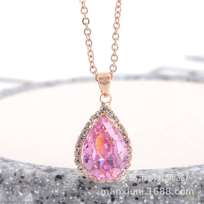 Rose gold geometric water drop pendant necklace on a model, showing adjustable chain and sparkling stone inlay.