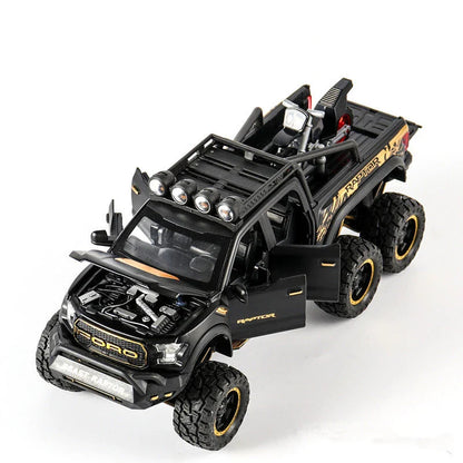 Realistic 1:28 scale Ford Raptor toy car with alloy body, lights, sounds, and pull-back action feature