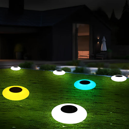White solar lawn light with UFO design for garden illumination, 300mm diameter with remote control