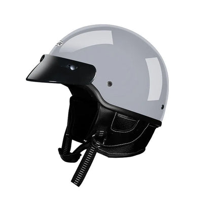 Retro full-face motorcycle helmet on a plain background, shown in cement grey colour.
