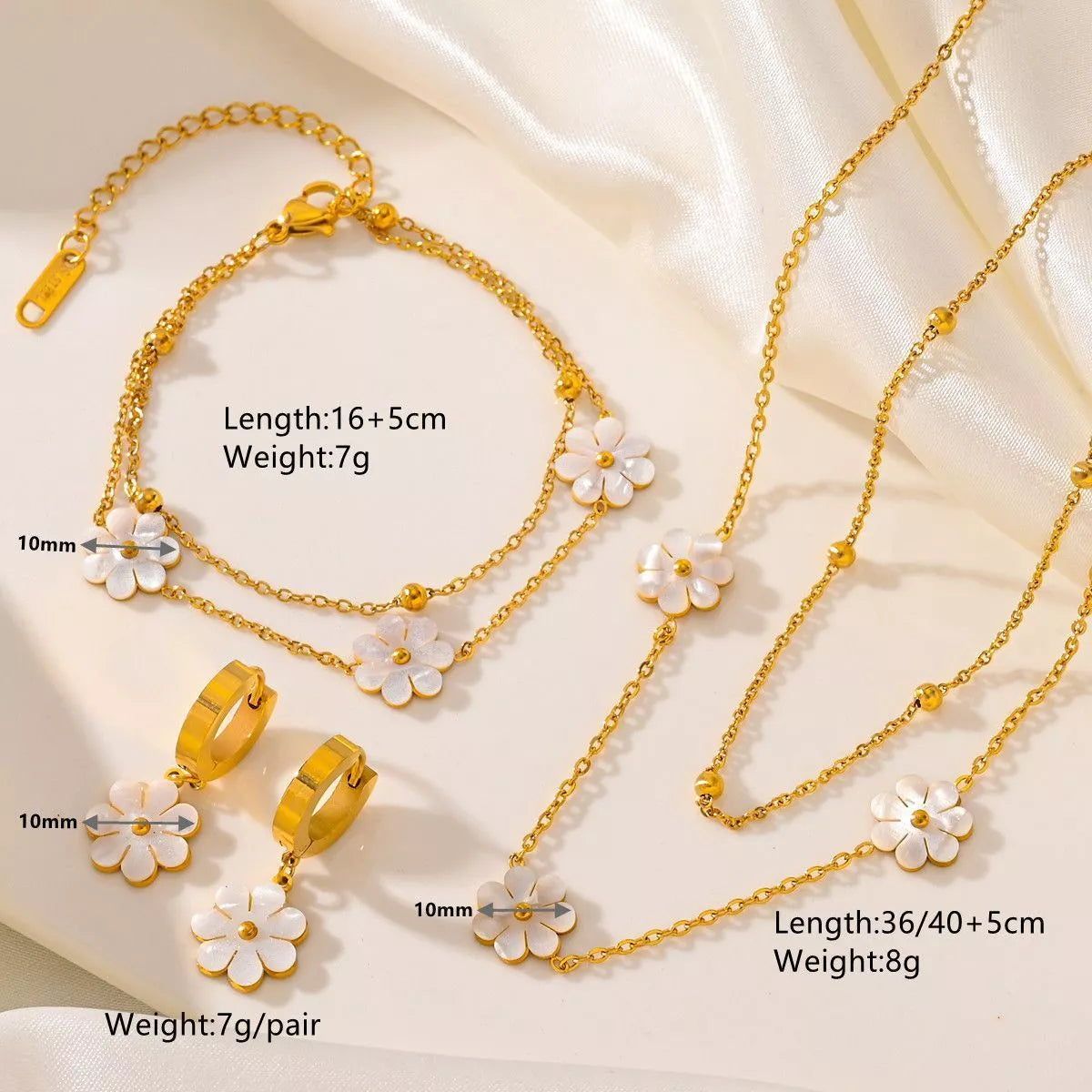 Stainless steel daisy flower jewelry set with necklace, bracelet, and earrings in electroplated gold finish