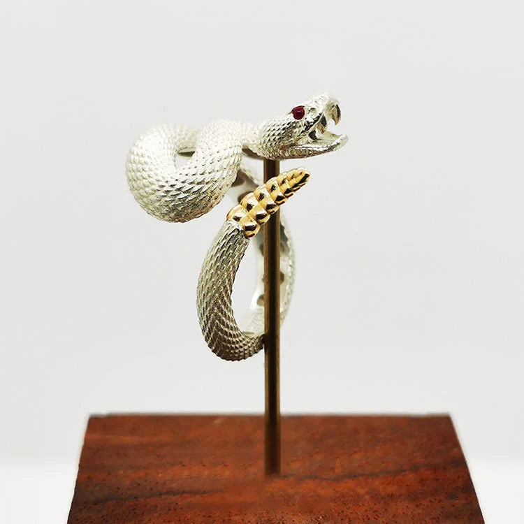 Adjustable snake ring with unique rattlesnake design in various color options, including white and black with open or shut mouth styles, and gold accents