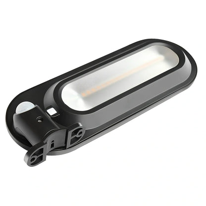 Solar wall light with black shell mounted on brick wall providing warm outdoor illumination