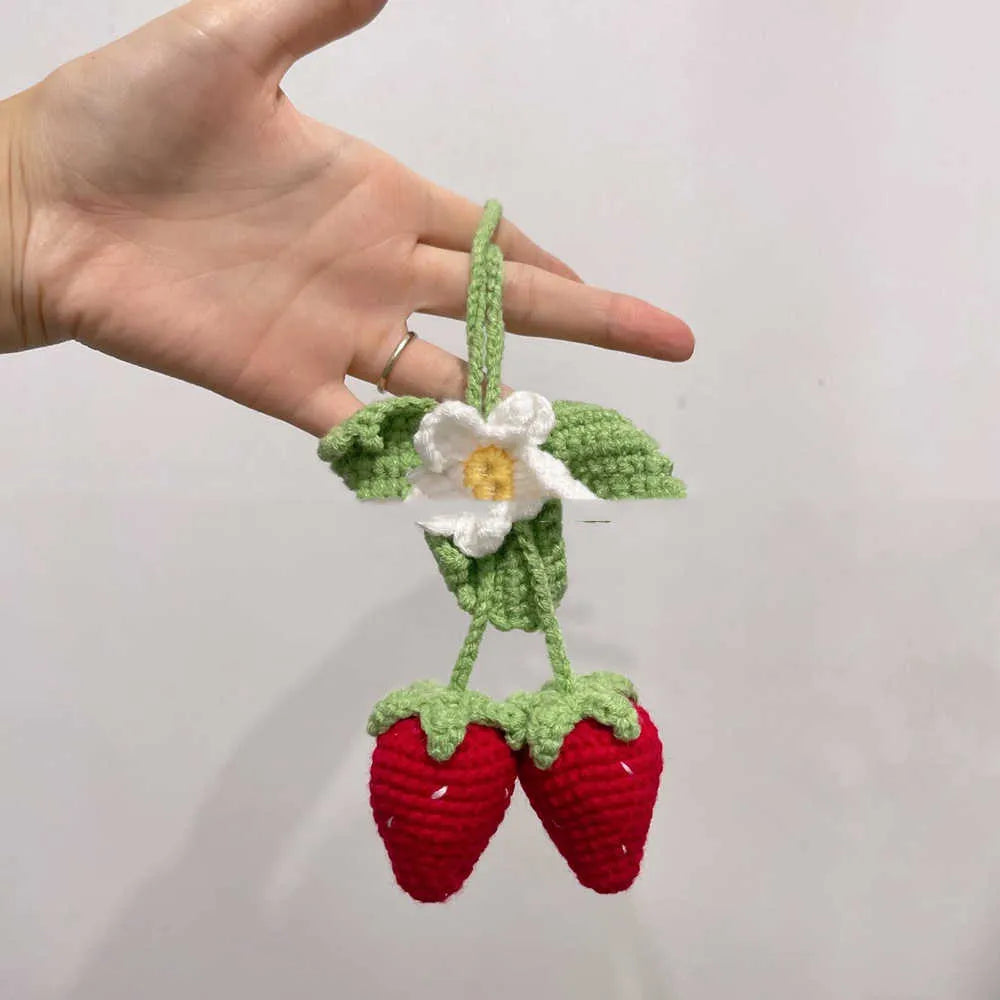 Handmade strawberry-shaped car pendant woven from cotton and hemp fibres, approximately 10-12cm long