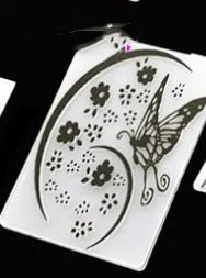 Set of ten plastic cake decorative moulds showing windmill, star, flower, and butterfly patterns.