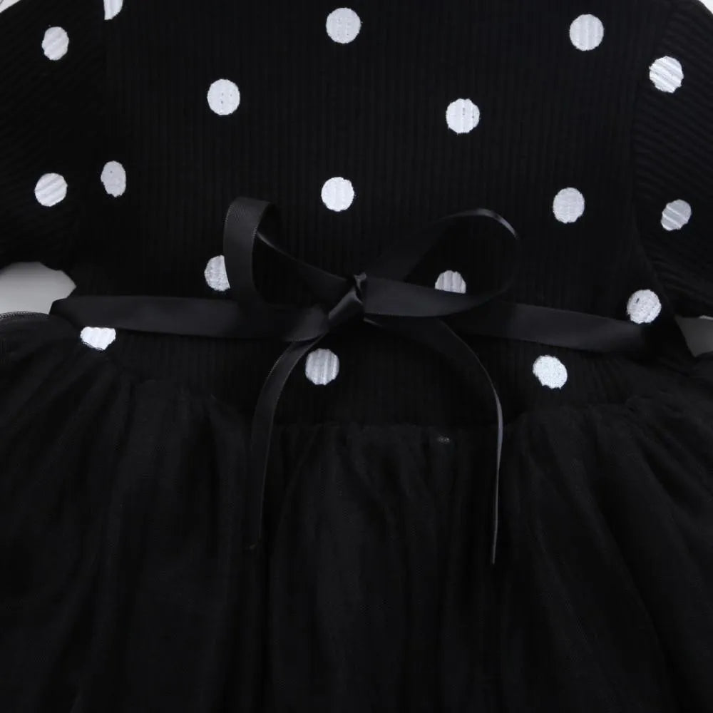 Baby girl's long sleeve black tutu lace dress with lace trim, shown on a hanger.