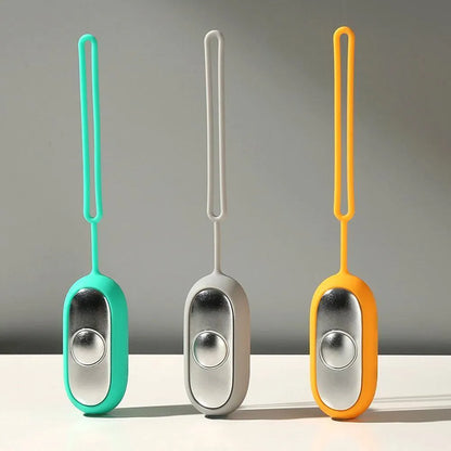 Hand-held micro-current sleep aid device in grey, green, and orange colour options
