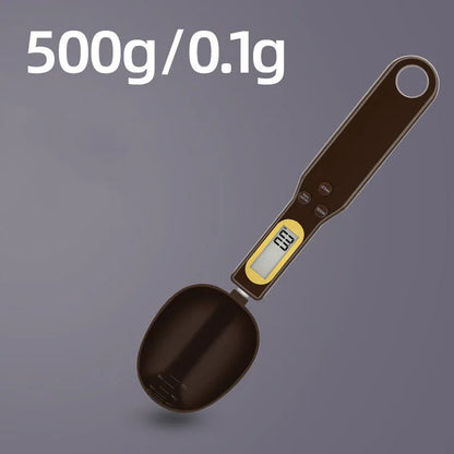 Black electronic measuring spoon scale showing digital display with spoon bowl for kitchen weighing