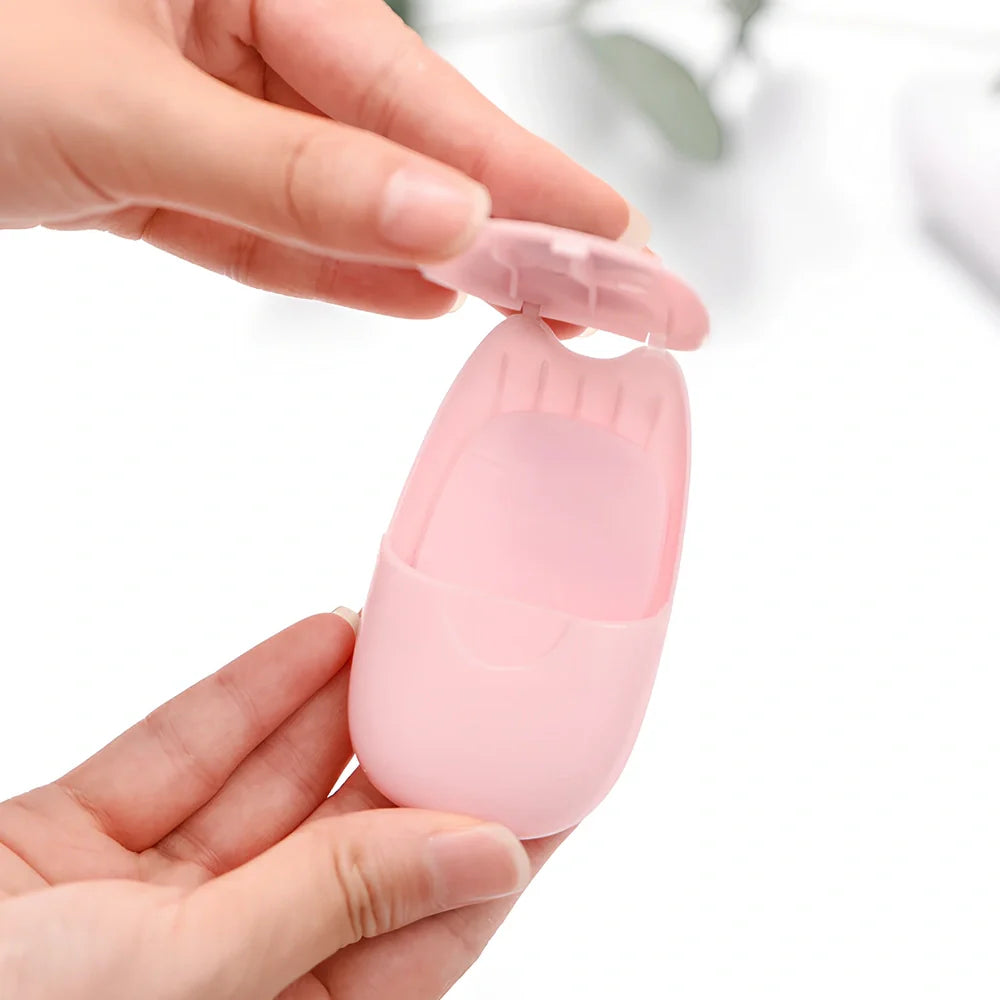 Pack of 50 pink biodegradable soap paper sheets, each 8x4.5cm, for portable hand cleaning on travels