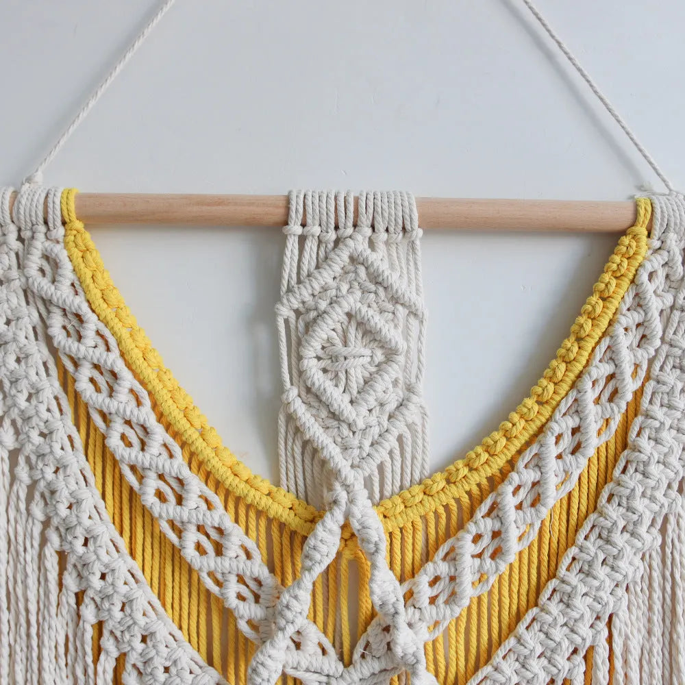 Creamy white hand-woven cotton tapestry with a rectangle shape for wall decor.