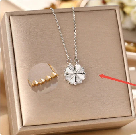 Elegant four-leaf clover pendant necklace with sparkling crystal heart detail, made of premium stainless steel for women's fashion jewelry gift