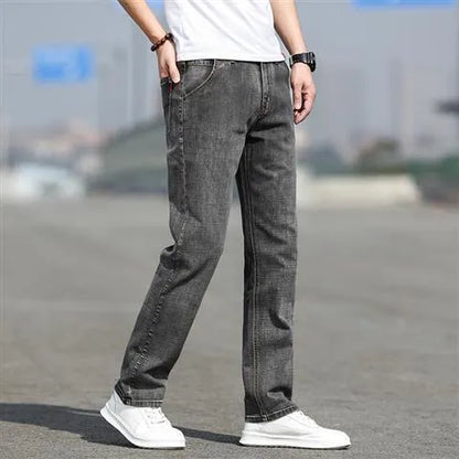 Smoky gray men's straight leg jeans with rabbit fur fabric on a hanger.