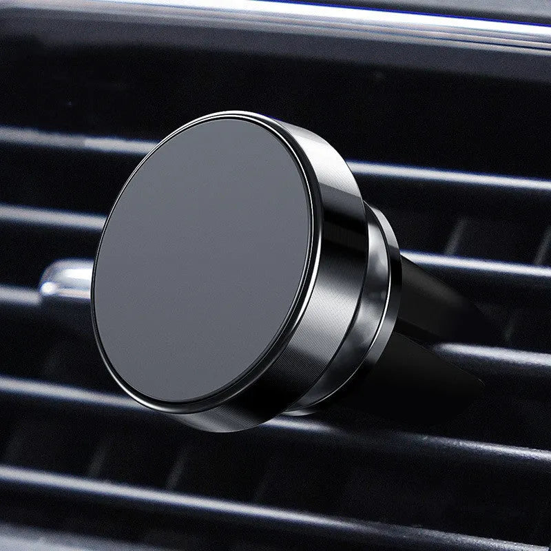 Aluminium alloy magnetic car phone holder mounted in a CD slot, holding a smartphone at an adjustable angle.
