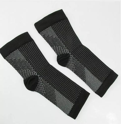 Anti-fatigue compression foot sleeves for men and women in black, red, and white