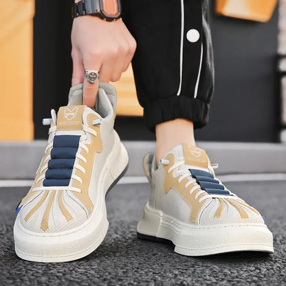 Men's beige low-top sneakers with elastic band closure and leather stitching on microfiber upper