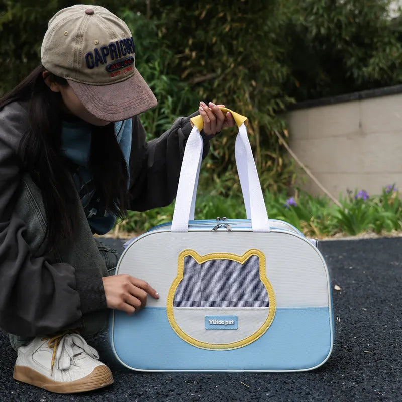 Outdoor portable foldable large capacity cat school bag made from breathable Oxford cloth in eight colour options including blue, pink, green, khaki, yellow and purple with a capacity of 15 jin suitable for pet transport, travel and daily use.
