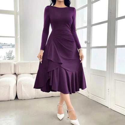 Purple women's dress with long sleeves, round neck, and ruffle detailing on a mannequin