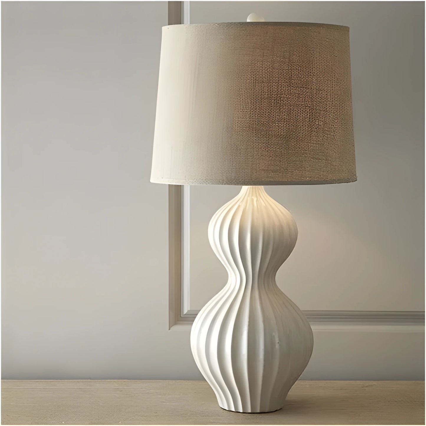 American country style ceramic table lamp with white fabric shade on wooden table