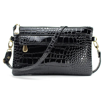 Women's black PU messenger bag showing horizontal square shape and shoulder strap