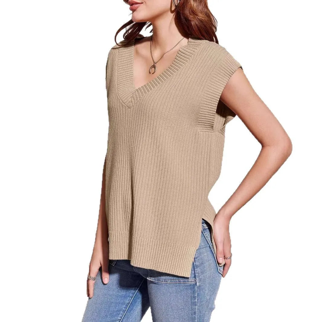 Camel coloured loose v-neck sleeveless vest with a striped pattern on a hanger.