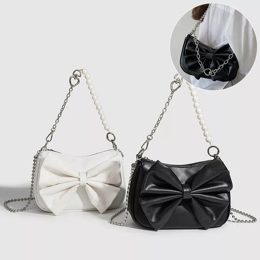 Black and white PU bow handbag with pearl chain, perfect for autumn winter fashion