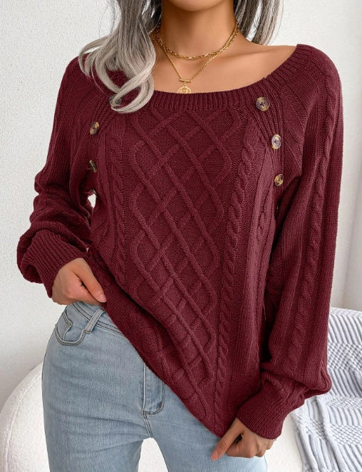 A stylish knitted sweater with a square neckline and button accents, available in a variety of trendy colors for a cozy and fashionable winter look.