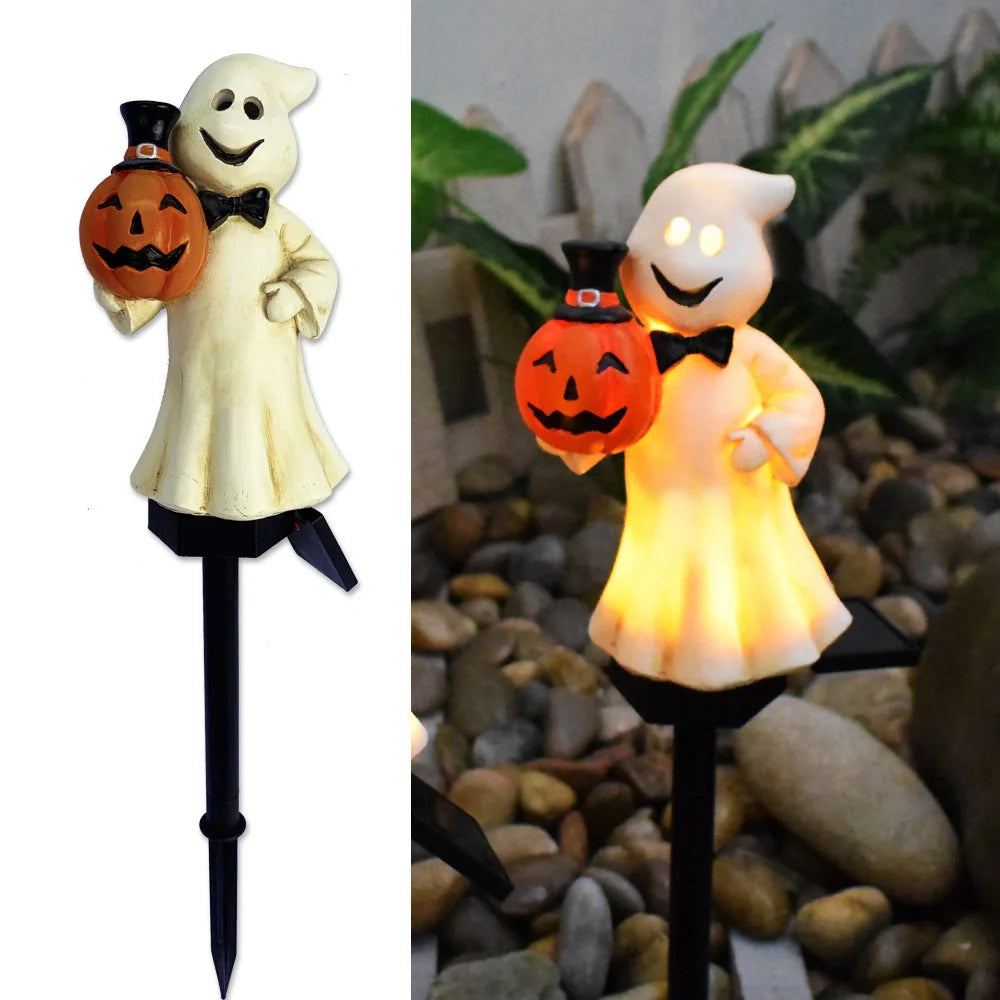 Solar-powered Halloween pumpkin lanterns lighting up a garden at night