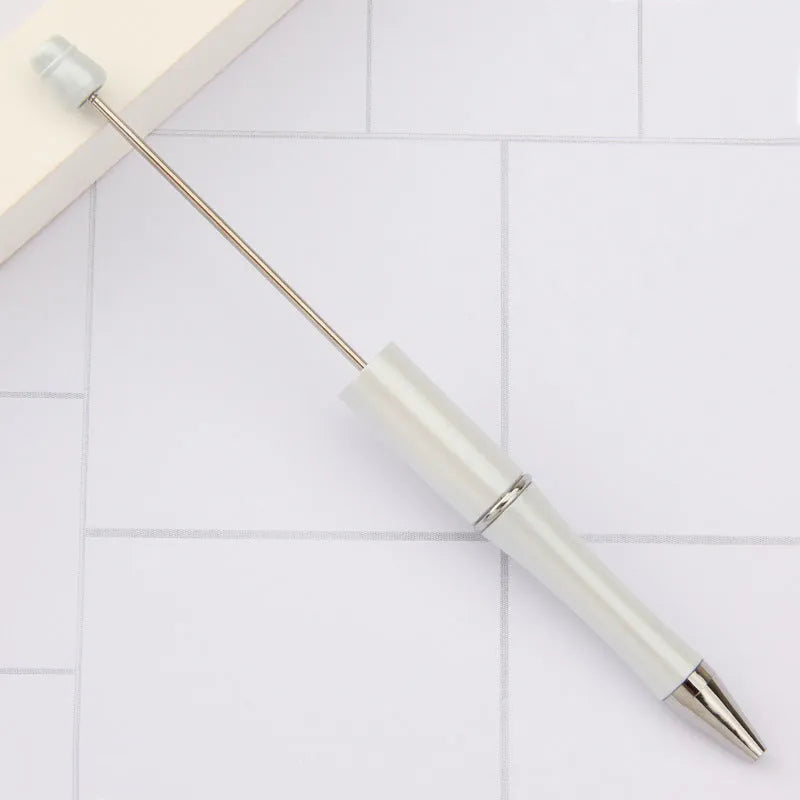 Rotating bead ballpoint pen in gradient colour with ABS plastic and steel wire construction