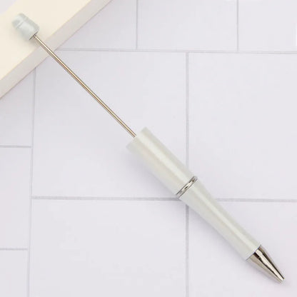 Rotating bead ballpoint pen in gradient colour with ABS plastic and steel wire construction