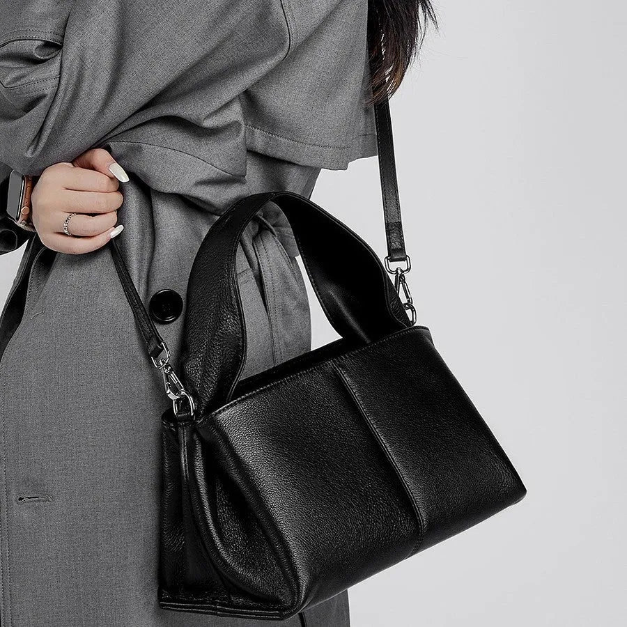 Women's genuine cowhide retro texture messenger bag in horizontal square shape, shown in apricot colour with double shoulder straps.