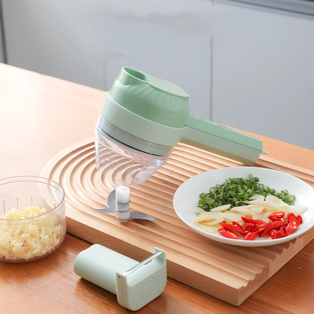 Green wireless vegetable cutter with stainless steel blade and transparent container for food processing