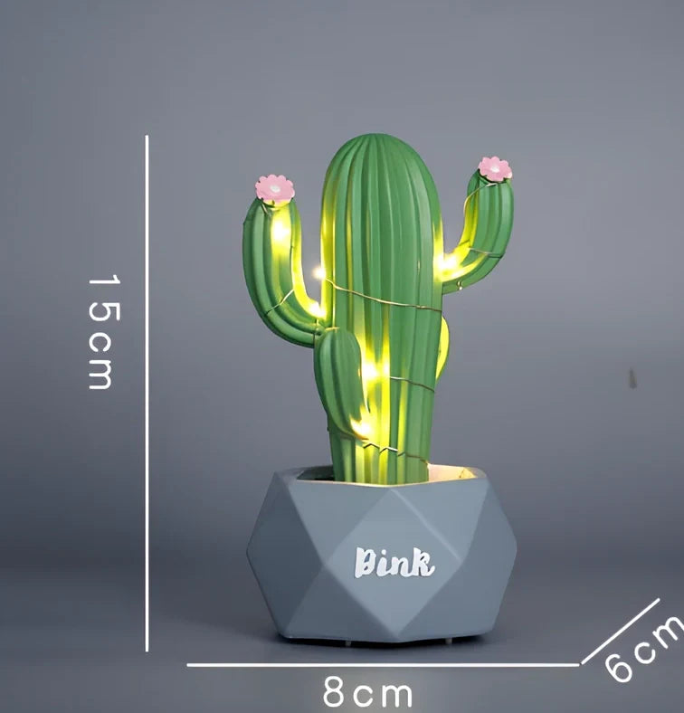 Cactus-shaped resin night light in gold finish measuring 15cm tall with warm LED glow
