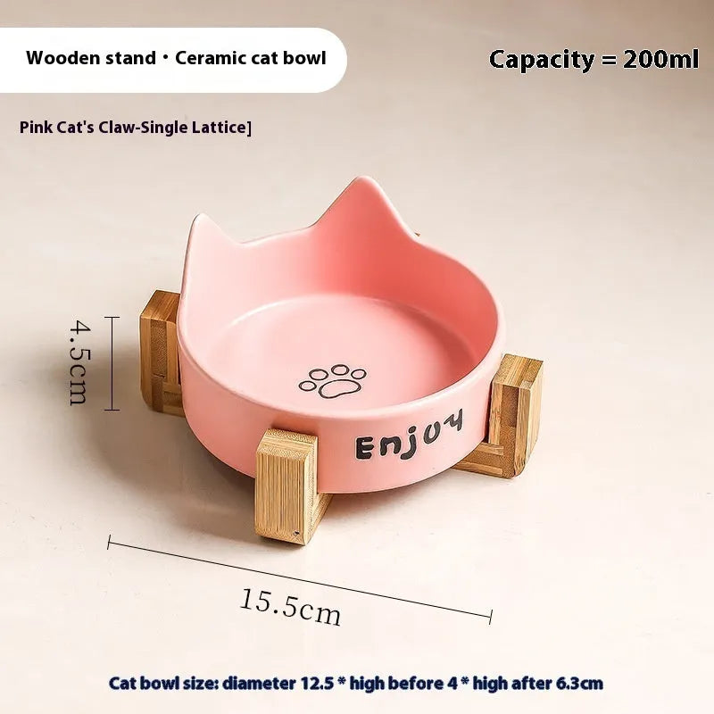 Porcelain cat bowl with anti-tumble wooden frame in pink with a cat paw design