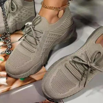 Women's solid colour sneakers with a thick sole, shown in multiple colour options.