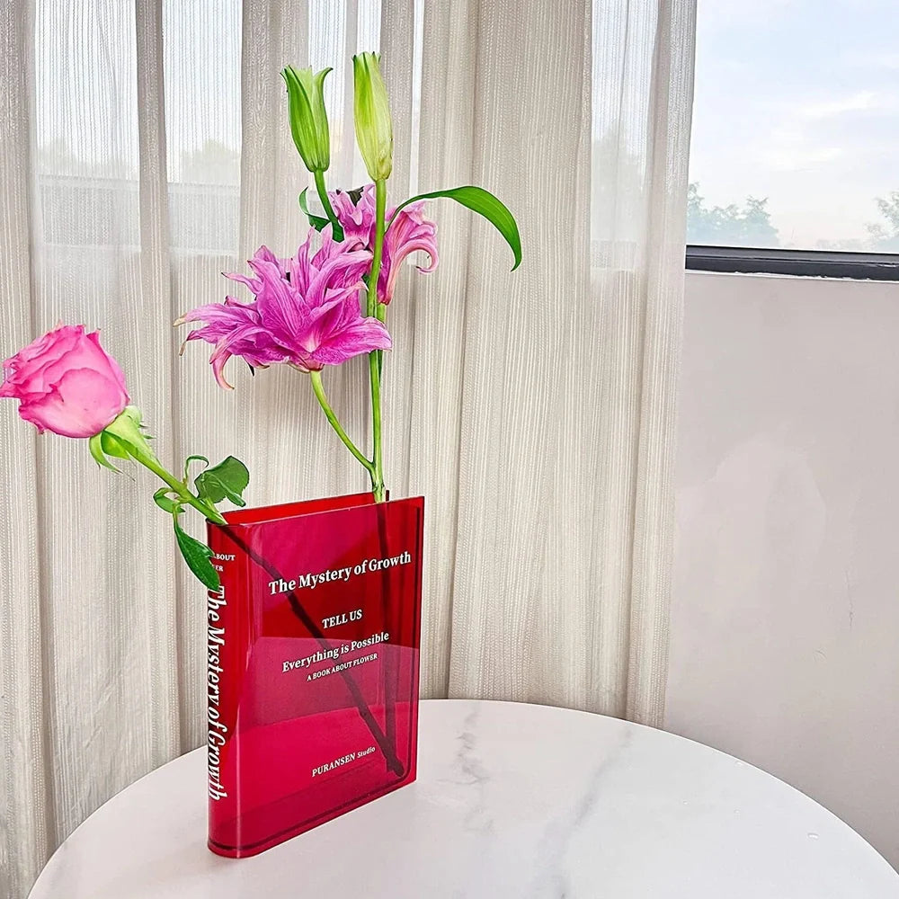 Transparent book-shaped acrylic vase, 22cm long with black font, refracting sunlight for home decor
