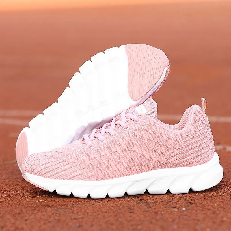 Women's running shoes with fly weaving upper material and wear-resistant outsole in black, pink, white colours