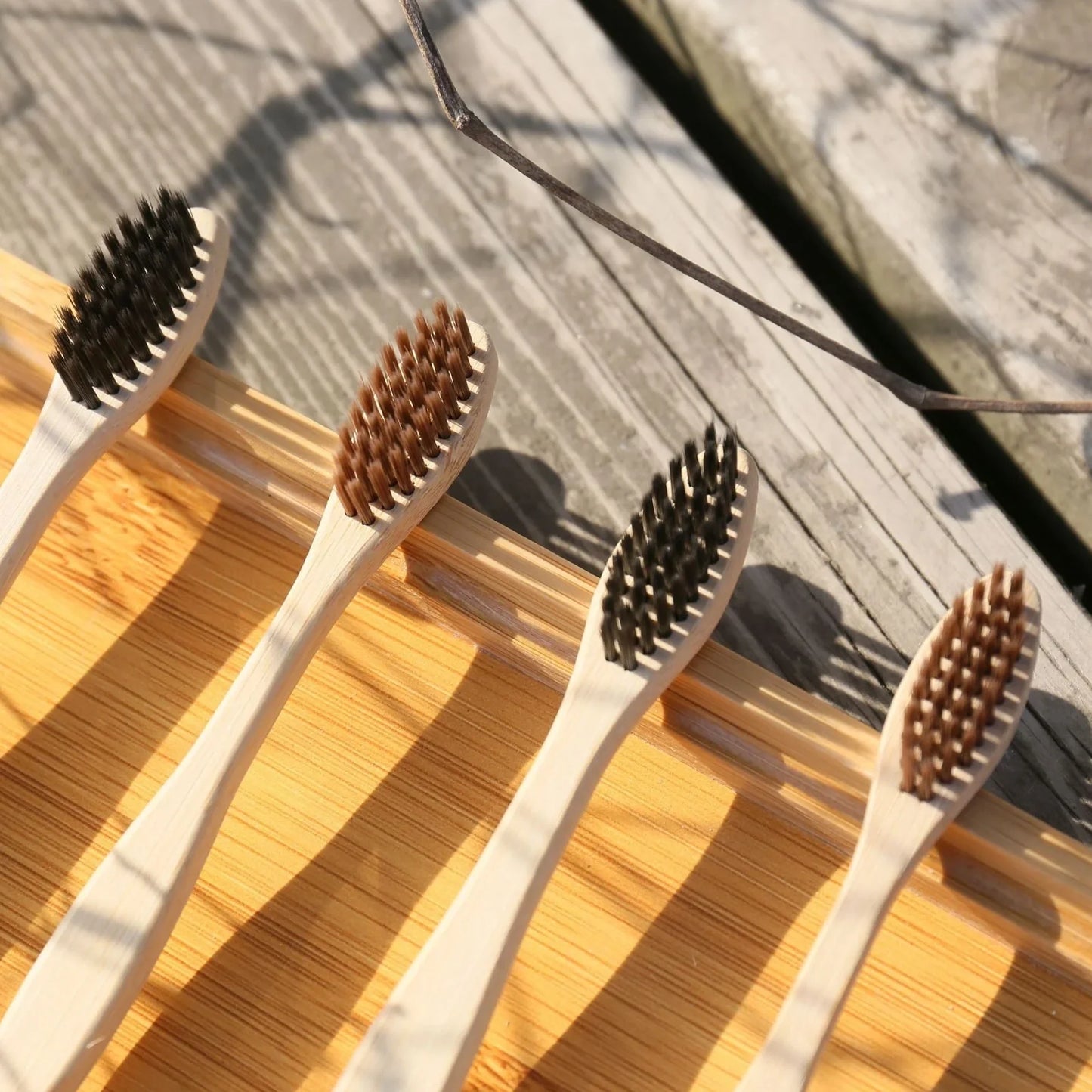 Organic bamboo toothbrush with 17.5cm ergonomic handle and charcoal-infused bristles for sustainable dental care