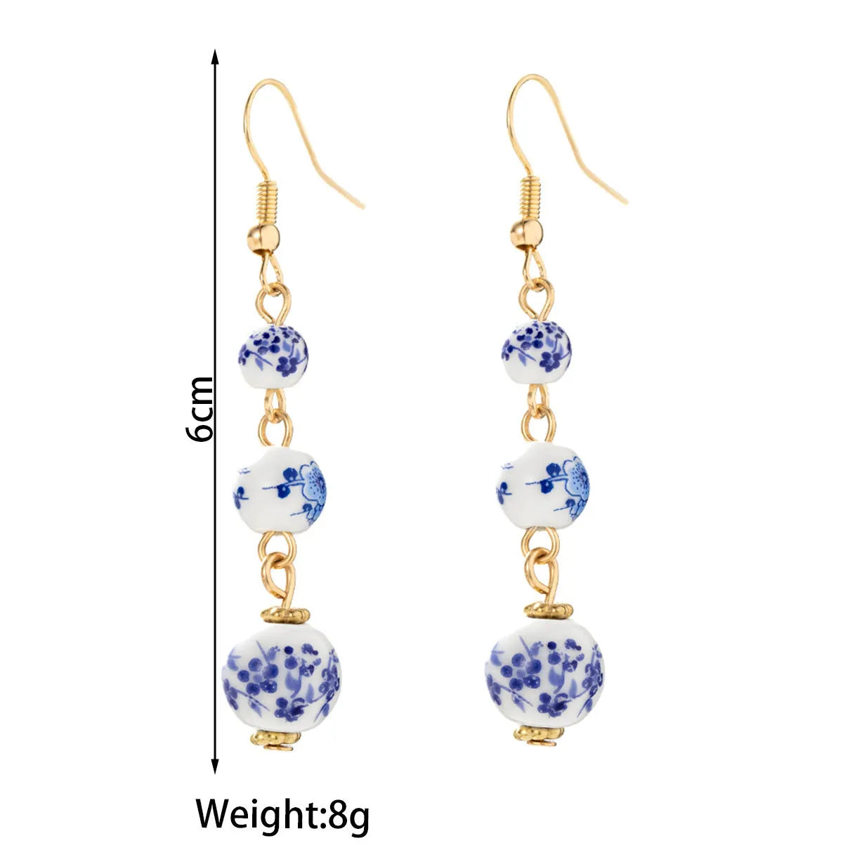 Long retro earrings with blue and white porcelain ceramic beads and geometric alloy construction