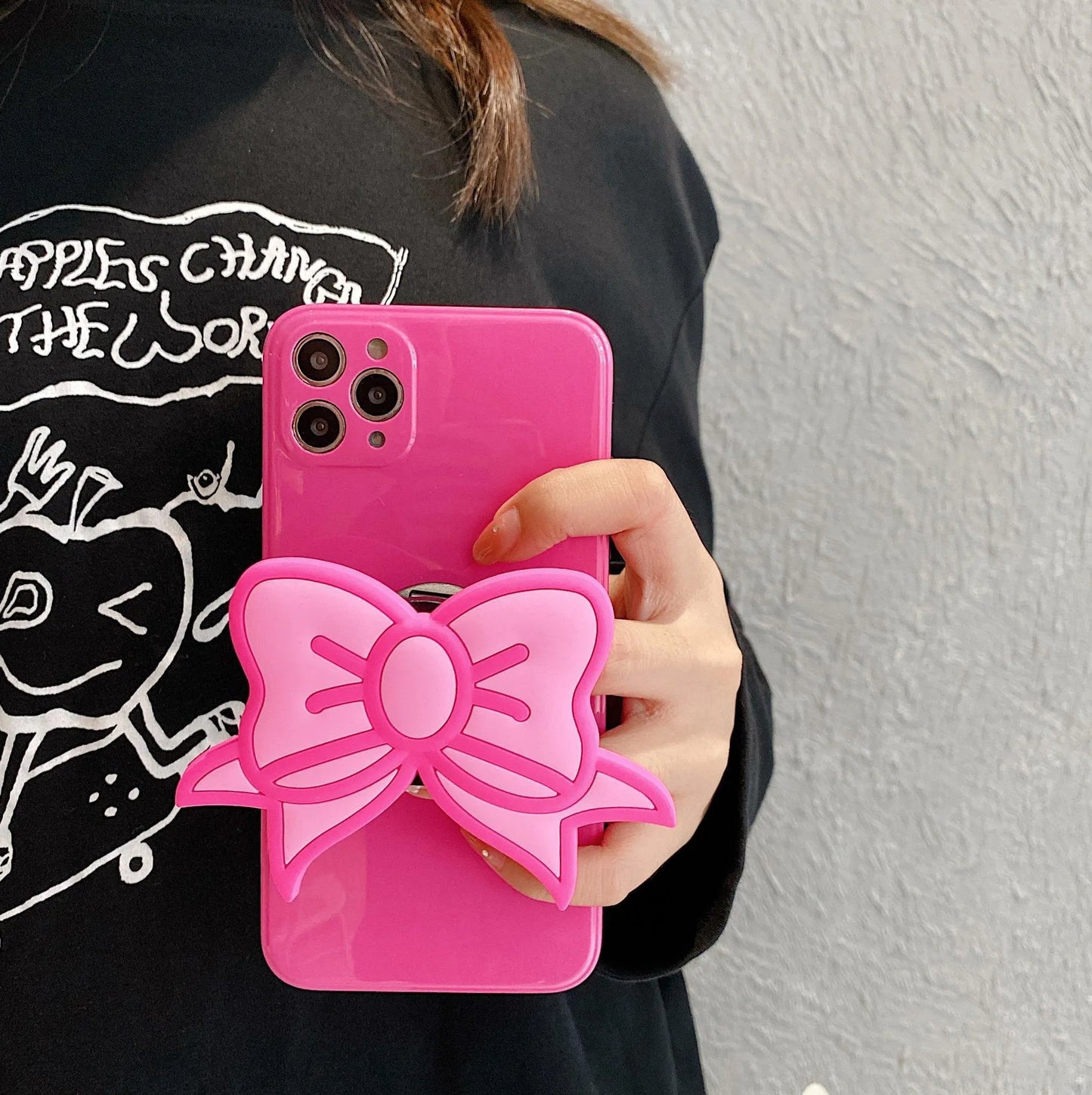 Rose red TPU iPhone case with integrated bow-shaped viewing stand